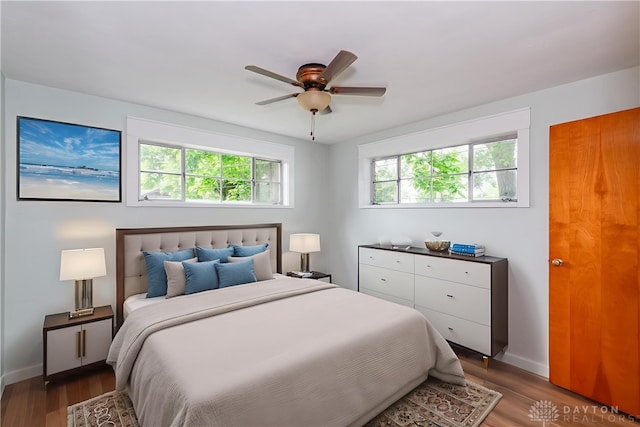 1208 Hale Ave, Dayton, OH 45419 - bedroom featuring baseboards, wood finished floors, and ceiling fan