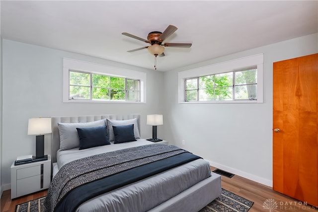 1208 Hale Ave, Dayton, OH 45419 - bedroom with wood finished floors, baseboards, and a ceiling fan