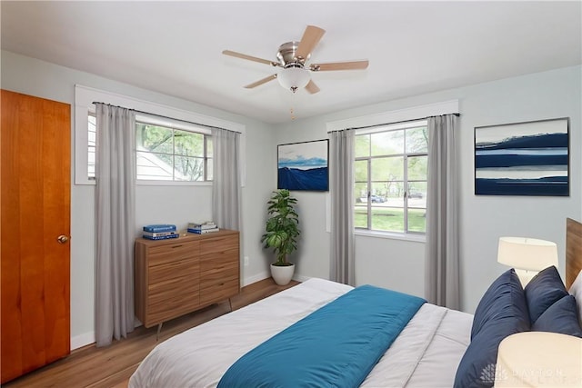 1208 Hale Ave, Dayton, OH 45419 - bedroom featuring wood finished floors, baseboards, and ceiling fan