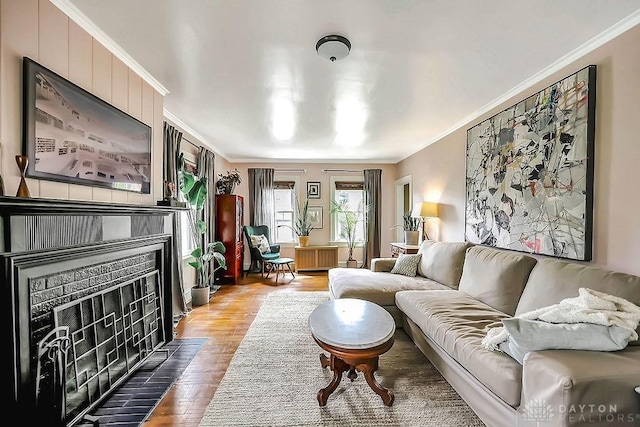 435 Marcia Ave, Hamilton, OH 45013 - living room featuring a fireplace with flush hearth, ornamental molding, wood finished floors, and radiator heating unit