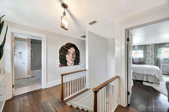 435 Marcia Ave, Hamilton, OH 45013 - hallway featuring an upstairs landing, wood finished floors, and baseboards