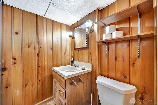 435 Marcia Ave, Hamilton, OH 45013 - half bath with vanity, toilet, and wooden walls