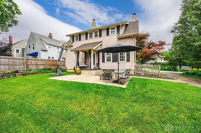 435 Marcia Ave, Hamilton, OH 45013 - rear view of house with a patio area and a chimney