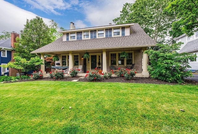 435 Marcia Ave, Hamilton, OH 45013 - view of front of home with a porch, a front yard, a chimney, and a shingled roof