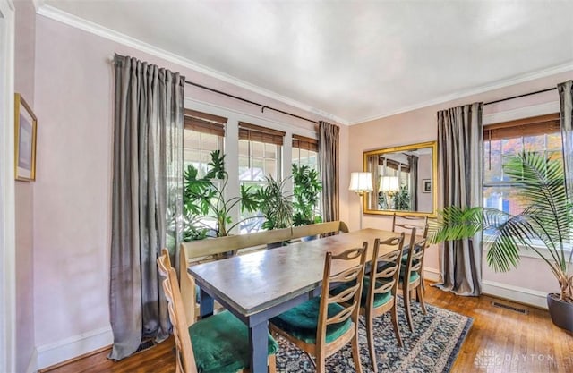 435 Marcia Ave, Hamilton, OH 45013 - dining space featuring baseboards, ornamental molding, and wood finished floors