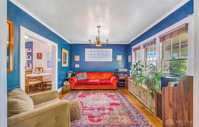 435 Marcia Ave, Hamilton, OH 45013 - living room with a chandelier, plenty of natural light, wood finished floors, and ornamental molding