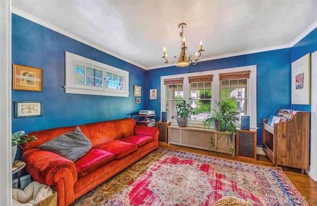 435 Marcia Ave, Hamilton, OH 45013 - living area featuring a chandelier, wood finished floors, and crown molding