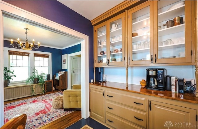 435 Marcia Ave, Hamilton, OH 45013 - bar area featuring a chandelier, ornamental molding, and decorative light fixtures
