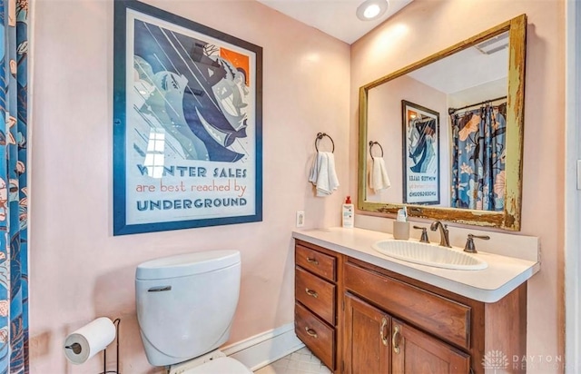 435 Marcia Ave, Hamilton, OH 45013 - bathroom featuring vanity, toilet, and baseboards