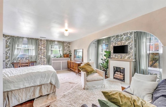 435 Marcia Ave, Hamilton, OH 45013 - bedroom with arched walkways and a fireplace with flush hearth