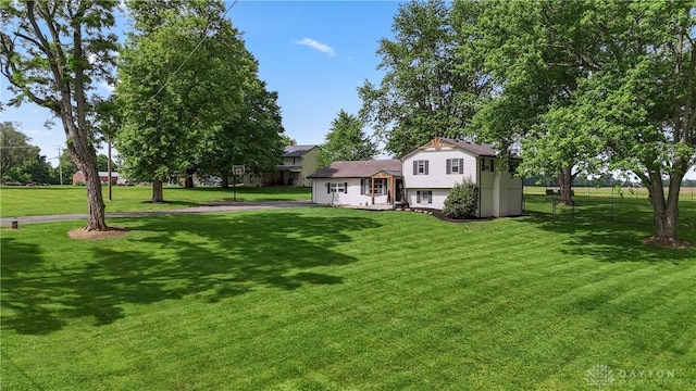 559 Stover Rd, West Alexandria, OH 45381 - view of grassy yard featuring asphalt driveway