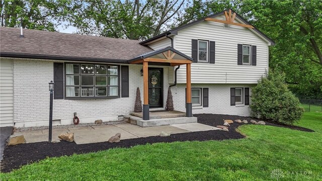 559 Stover Rd, West Alexandria, OH 45381 - tri-level home featuring brick siding and roof with shingles