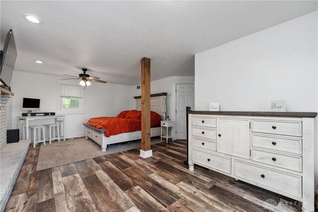 559 Stover Rd, West Alexandria, OH 45381 - bedroom featuring dark wood-type flooring, baseboards, recessed lighting, a brick fireplace, and ceiling fan