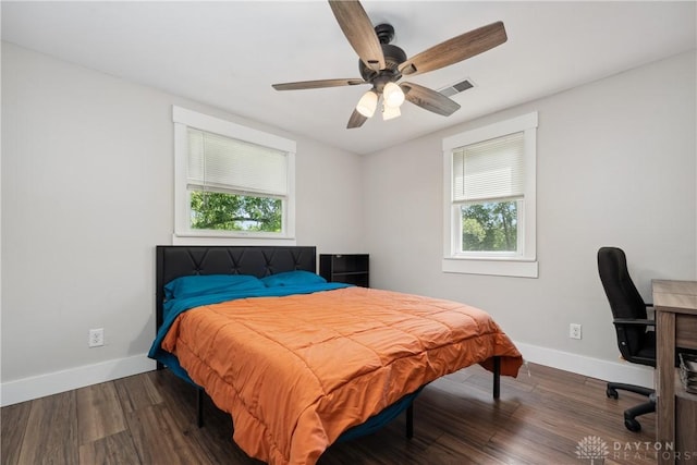 559 Stover Rd, West Alexandria, OH 45381 - bedroom with multiple windows, baseboards, and wood finished floors