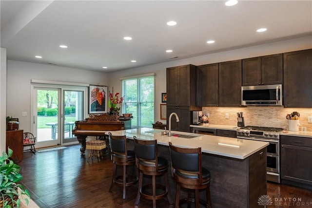 197 Harbour Dr, Springboro, OH 45066 - kitchen featuring appliances with stainless steel finishes, a sink, light countertops, plenty of natural light, and recessed lighting