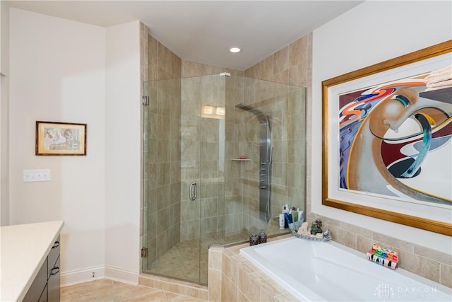 197 Harbour Dr, Springboro, OH 45066 - bathroom featuring a stall shower, a bath, vanity, baseboards, and recessed lighting