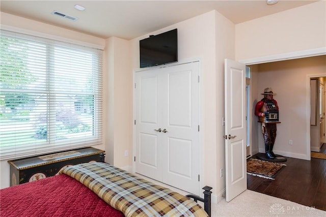 197 Harbour Dr, Springboro, OH 45066 - bedroom featuring multiple windows, baseboards, and wood finished floors