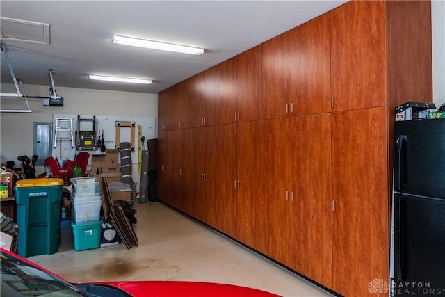 197 Harbour Dr, Springboro, OH 45066 - garage featuring freestanding refrigerator and a garage door opener
