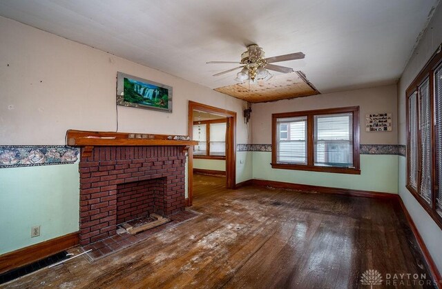 2057 Rugby Rd, Dayton, OH 45406 - unfurnished living room featuring a fireplace, wood-type flooring, and ceiling fan