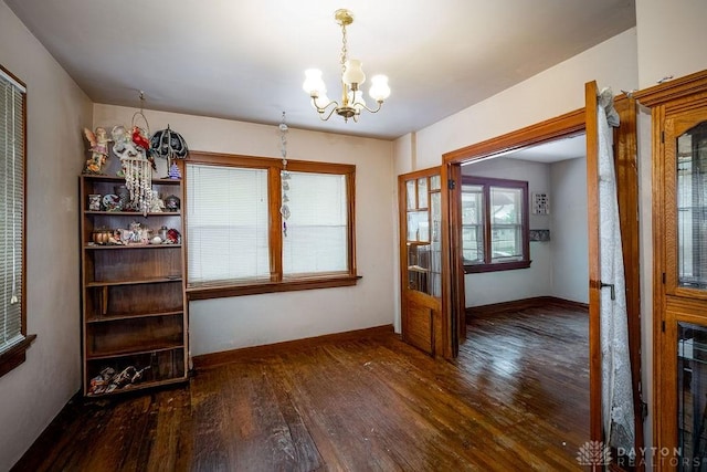 2057 Rugby Rd, Dayton, OH 45406 - unfurnished dining area featuring a chandelier and dark wood-style floors