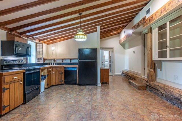 9891 Sugar St, Germantown, OH 45327 - kitchen featuring black appliances, brown cabinetry, decorative light fixtures, and vaulted ceiling