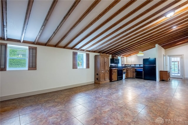9891 Sugar St, Germantown, OH 45327 - unfurnished living room with lofted ceiling and healthy amount of natural light