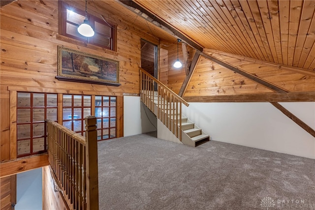 9891 Sugar St, Germantown, OH 45327 - staircase featuring wooden ceiling, wooden walls, lofted ceiling, and carpet flooring