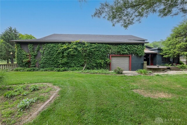 9891 Sugar St, Germantown, OH 45327 - view of yard with an attached garage and driveway