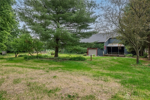 9891 Sugar St, Germantown, OH 45327 - view of grassy yard featuring an attached garage