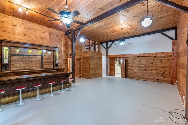 9891 Sugar St, Germantown, OH 45327 - unfurnished living room with ceiling fan, wood walls, finished concrete floors, wood ceiling, and a dry bar