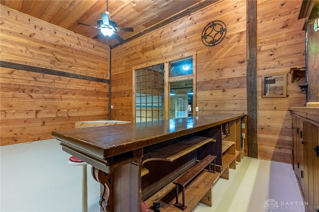 9891 Sugar St, Germantown, OH 45327 - dining room with wood walls, wooden ceiling, and a ceiling fan