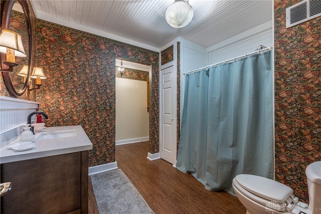 9891 Sugar St, Germantown, OH 45327 - bathroom with vanity, wood finished floors, wallpapered walls, and a shower with curtain