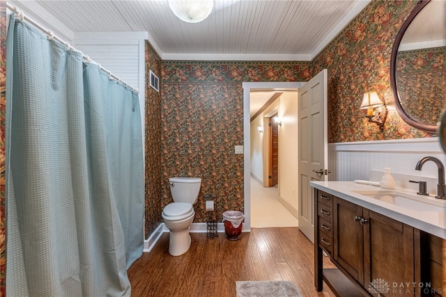 9891 Sugar St, Germantown, OH 45327 - full bathroom with wood finished floors, a wainscoted wall, wallpapered walls, vanity, and crown molding