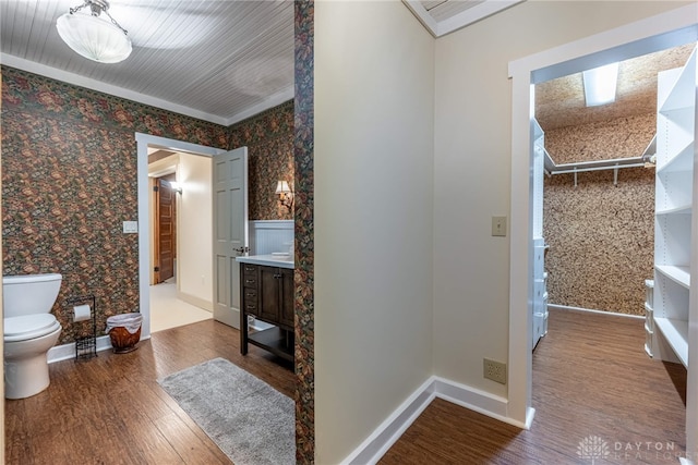 9891 Sugar St, Germantown, OH 45327 - bathroom featuring wallpapered walls, wood finished floors, vanity, and ornamental molding