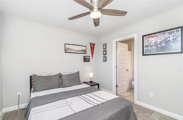 902 Brownstone Row, Springboro, OH 45066 - carpeted bedroom featuring baseboards, connected bathroom, and a ceiling fan