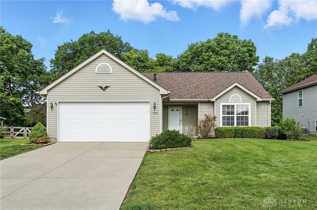 5555 Stone Path Dr, Middletown, OH 45042 - single story home featuring a front yard, an attached garage, concrete driveway, and roof with shingles
