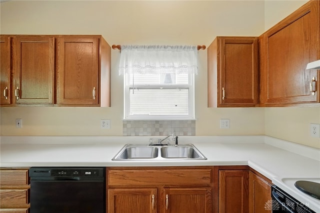 5555 Stone Path Dr, Middletown, OH 45042 - kitchen with black dishwasher, a sink, light countertops, and brown cabinetry
