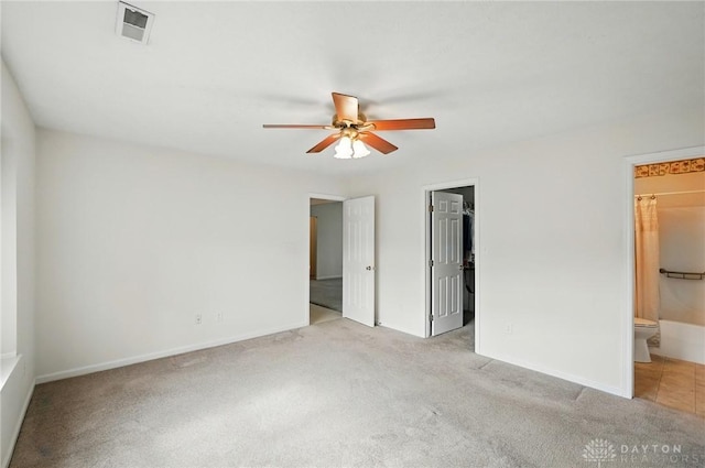 5555 Stone Path Dr, Middletown, OH 45042 - unfurnished bedroom featuring light carpet, a spacious closet, ensuite bathroom, and baseboards