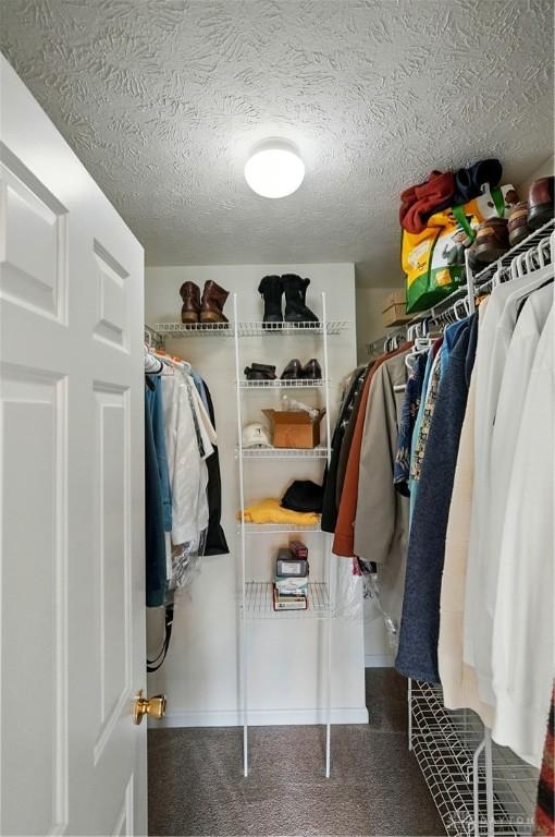 5555 Stone Path Dr, Middletown, OH 45042 - walk in closet featuring carpet flooring