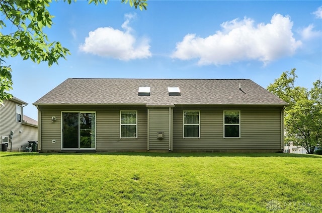 5555 Stone Path Dr, Middletown, OH 45042 - rear view of house featuring a lawn and central AC unit