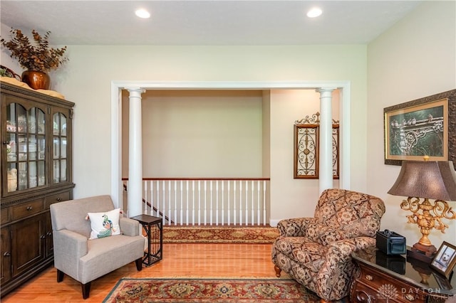 2082 Tamarack Ridge Ct, Beavercreek, OH 45431 - sitting room with light wood finished floors, recessed lighting, and ornate columns