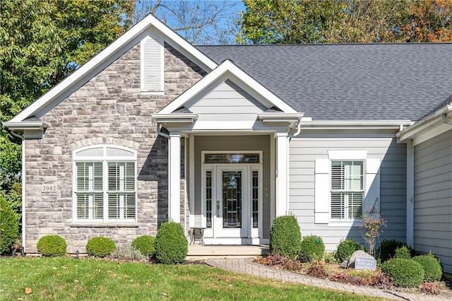 2082 Tamarack Ridge Ct, Beavercreek, OH 45431 - view of front facade featuring stone siding and a shingled roof
