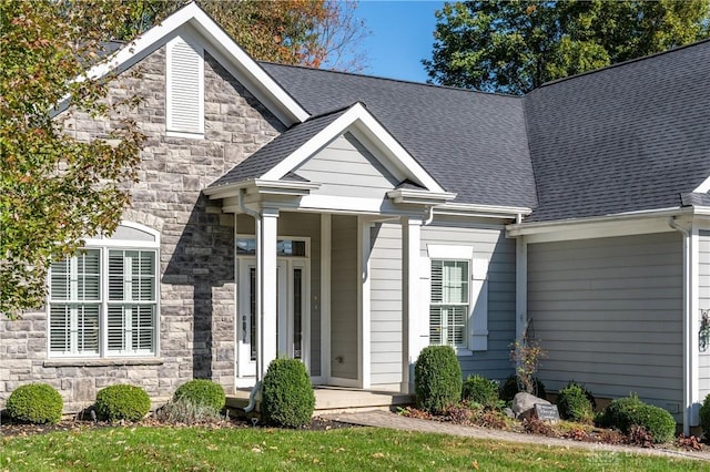 2082 Tamarack Ridge Ct, Beavercreek, OH 45431 - view of front facade with stone siding and roof with shingles