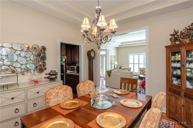 2082 Tamarack Ridge Ct, Beavercreek, OH 45431 - dining area with a chandelier and wood finished floors
