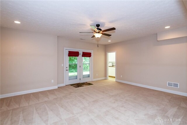 2082 Tamarack Ridge Ct, Beavercreek, OH 45431 - spare room featuring light colored carpet, ceiling fan, recessed lighting, and a textured ceiling