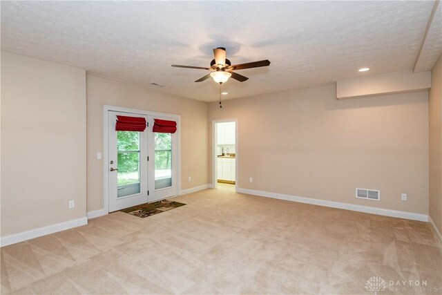 2082 Tamarack Ridge Ct, Beavercreek, OH 45431 - spare room with light carpet, a ceiling fan, recessed lighting, and a textured ceiling