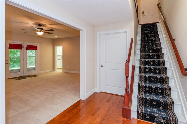 2082 Tamarack Ridge Ct, Beavercreek, OH 45431 - stairway with ceiling fan, wood finished floors, and carpet floors