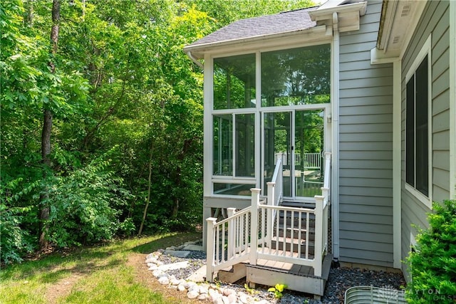 2082 Tamarack Ridge Ct, Beavercreek, OH 45431 - view of home's exterior featuring a sunroom and a shingled roof
