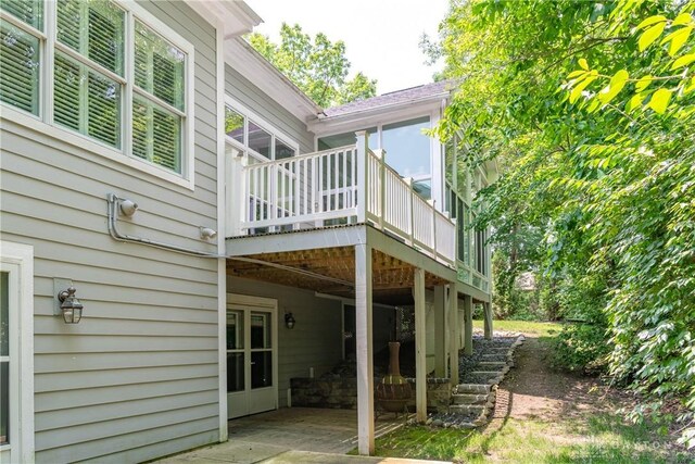 2082 Tamarack Ridge Ct, Beavercreek, OH 45431 - back of house featuring a wooden deck and a patio area