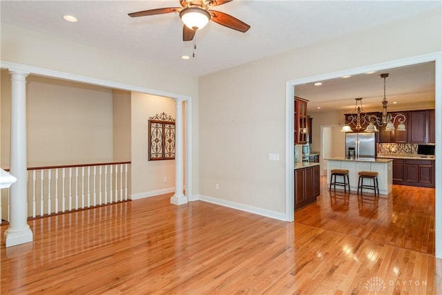 2082 Tamarack Ridge Ct, Beavercreek, OH 45431 - unfurnished living room with ceiling fan, light wood-style floors, and recessed lighting